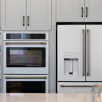 Painted gray kitchen cabinets and island.