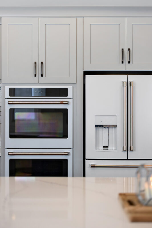Painted gray kitchen cabinets and island.