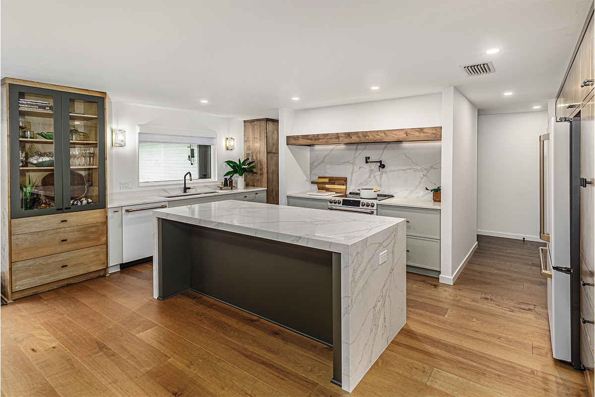 Multi-color kitchen with two-tone hutch, painted cabinets with stained accents.