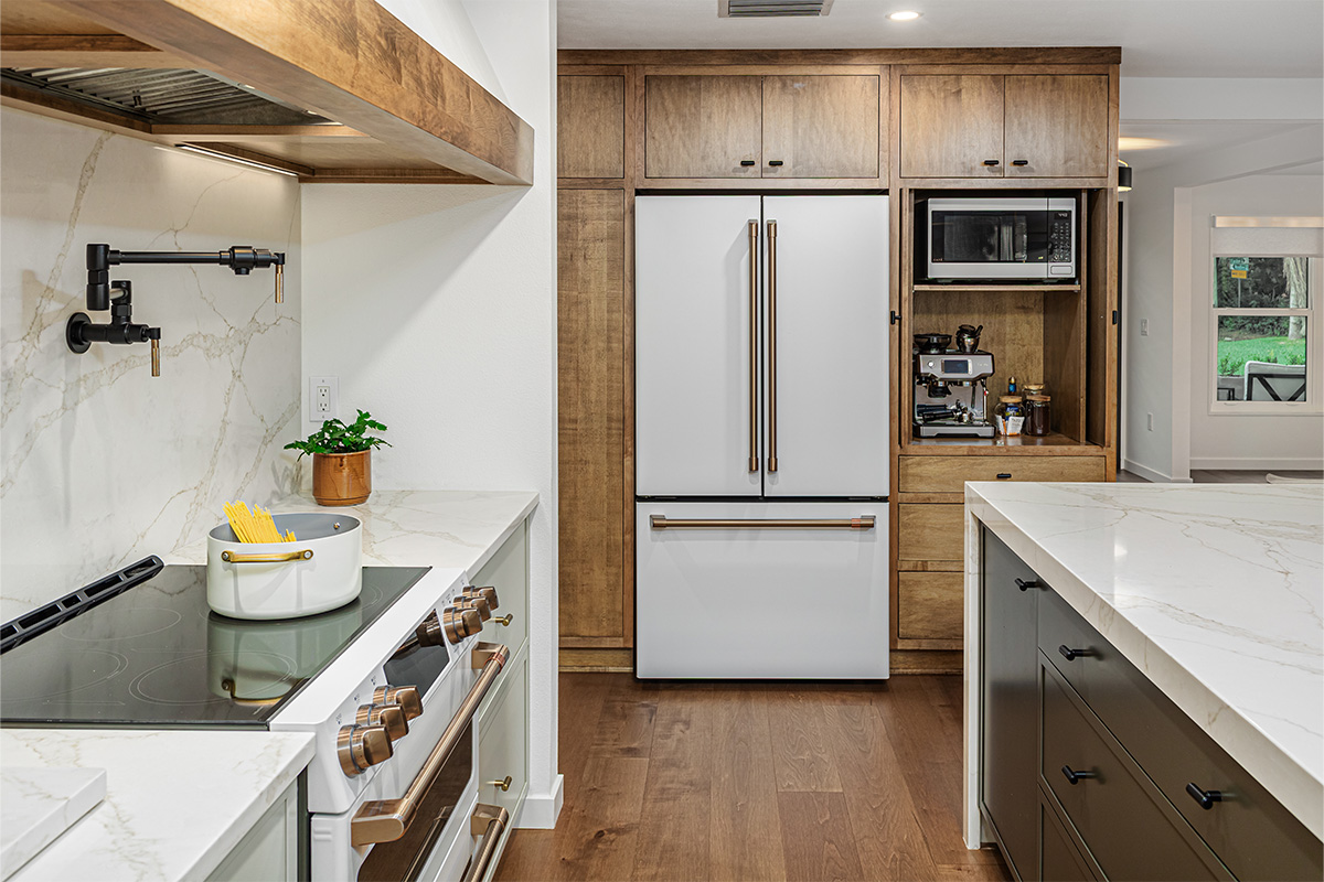 Multi-color kitchen with two-tone hutch, painted cabinets with stained accents.