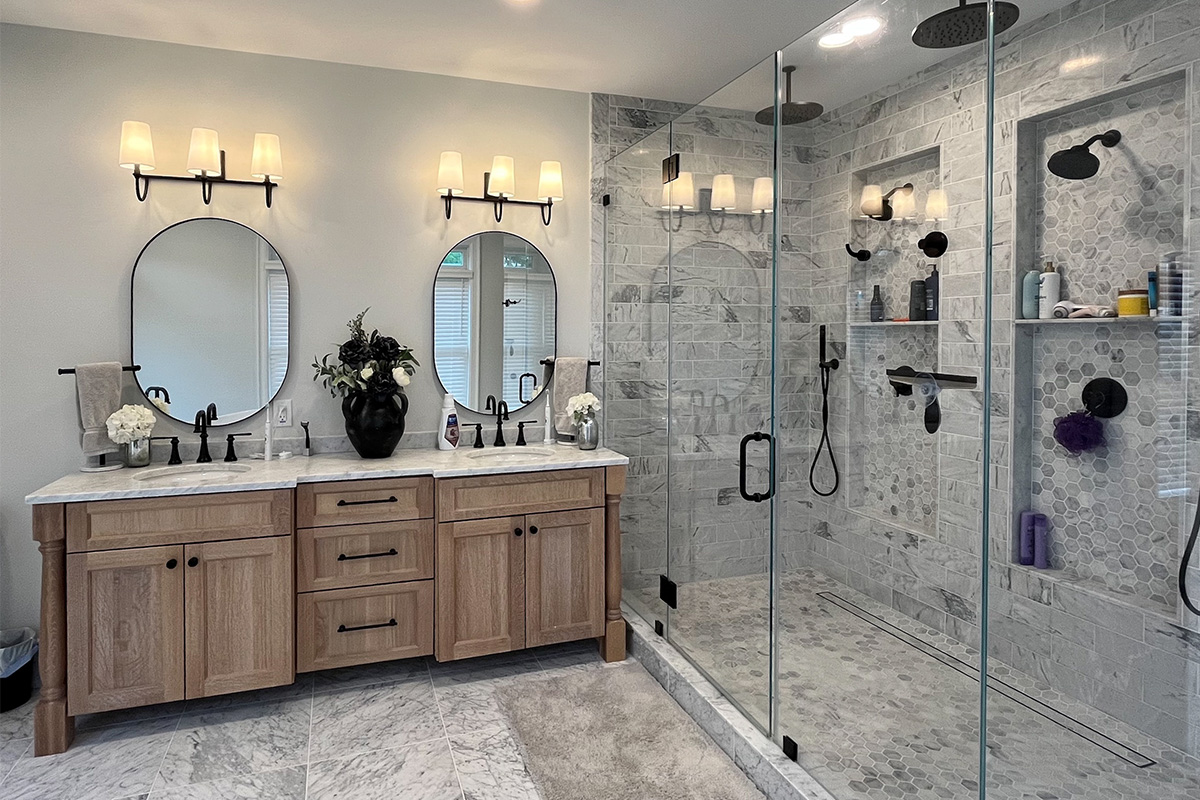 Master Bathroom with natural stained vanity and glass shower