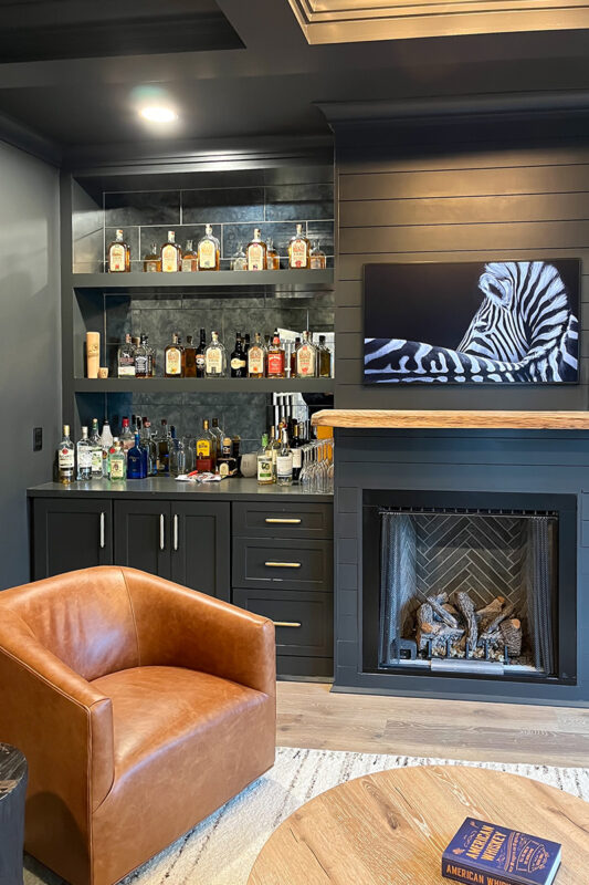 Living space with bar and fireplace.