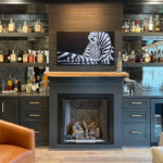 Living space with bar and fireplace.