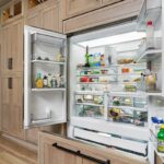 Light stained perimeter kitchen cabinets.