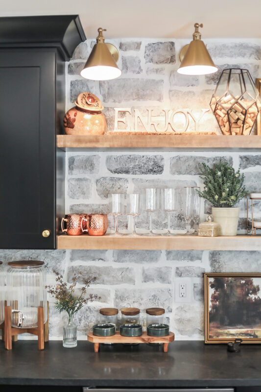 Black bar cabinets with stained floating shelves