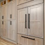 Light stained perimeter kitchen cabinets.