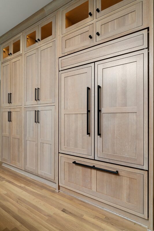 Light stained perimeter kitchen cabinets.