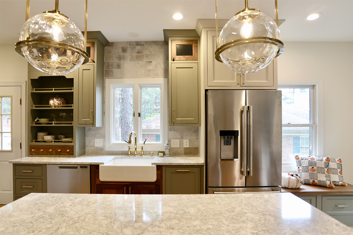 Painted green kitchen cabinets.