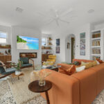 Living room space with walnut natural cabinets