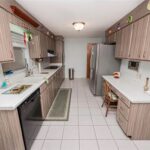 Before photo of a narrow galley kitchen before the remodel