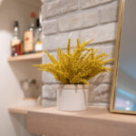 Kitchen with White perimeter cabinets and Quartersawn White Oak island cabinets stained in light brown Pampas finish.
