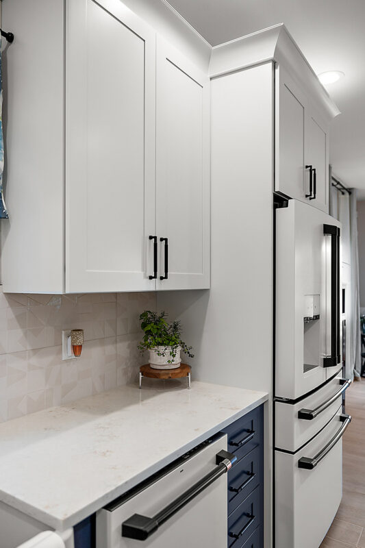White kitchen cabinets and fridge
