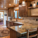 Rustic hickory kithen cabinets with brown stain