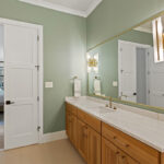 Light stained bathroom vanity cabinet