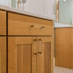 Light stained bathroom vanity cabinet