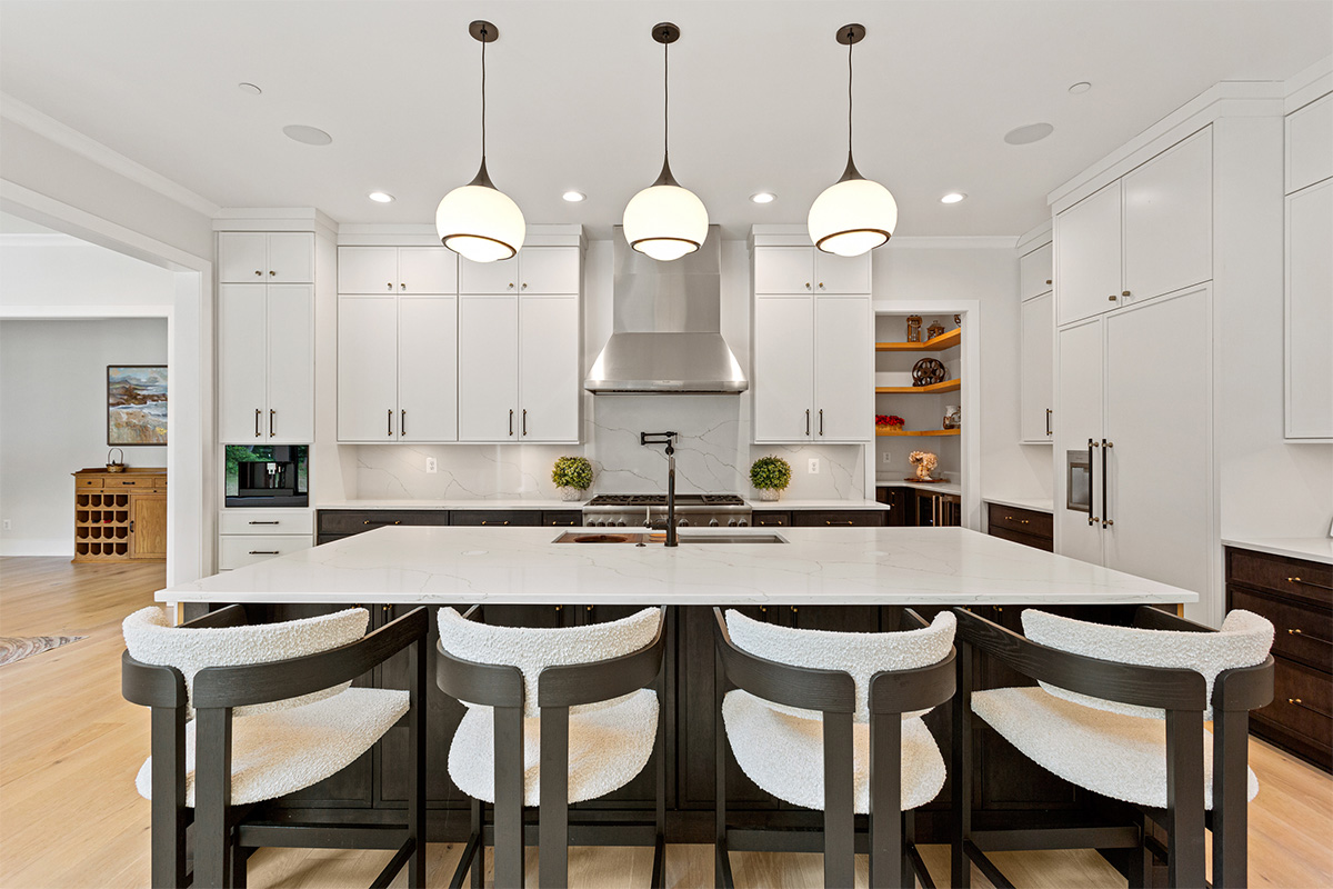 Kitchen with painted white and dark stained cabinets