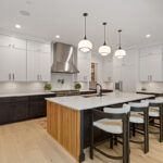 Kitchen with painted white and dark stained cabinets