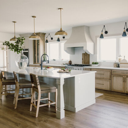 kitchen with painted island and stained perimeter.