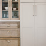 kitchen with painted island and stained perimeter.