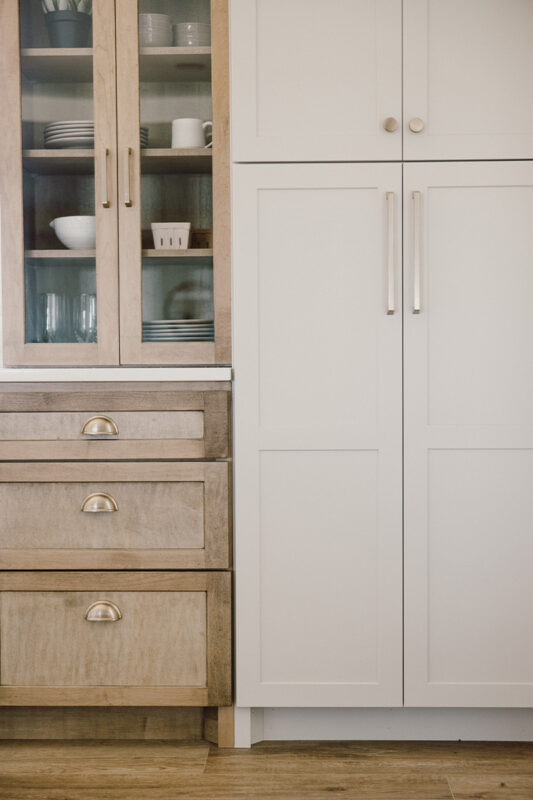 kitchen with painted island and stained perimeter.