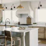 kitchen with painted island and stained perimeter.