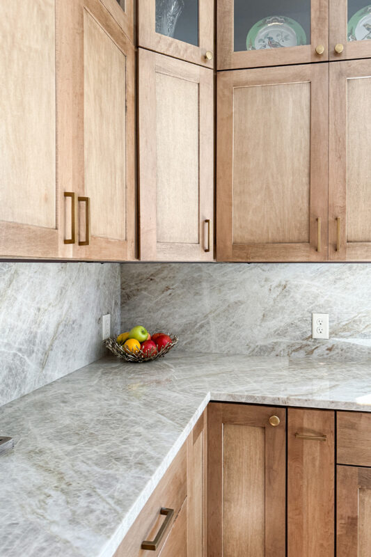 Cashew-stained kitchen perimeter cabinets.