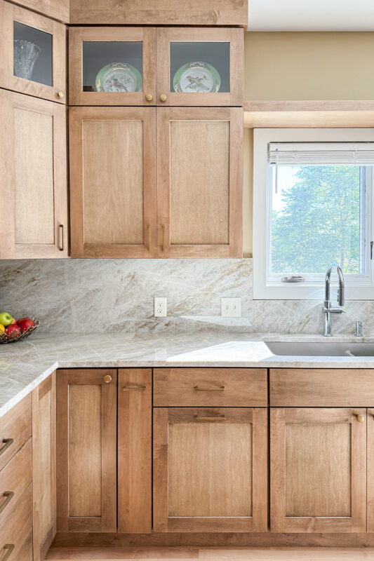 Cashew-stained kitchen perimeter cabinets.