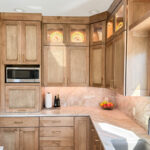 Cashew-stained kitchen perimeter cabinets.