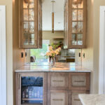 Cashew-stained kitchen perimeter cabinets.