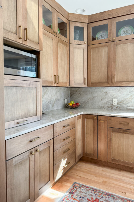 Cashew-stained kitchen perimeter cabinets.