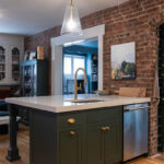 Purple painted kitchen island cabinets.