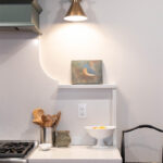 Purple painted kitchen cabinet beside the stove.