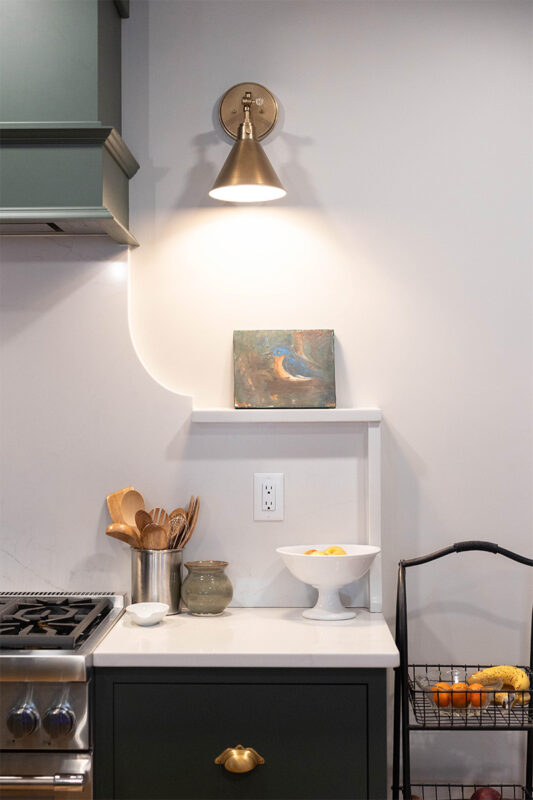 Purple painted kitchen cabinet beside the stove.