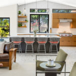 Kitchen with natural cherry perimeter cabinets and dark stained island cabinets.