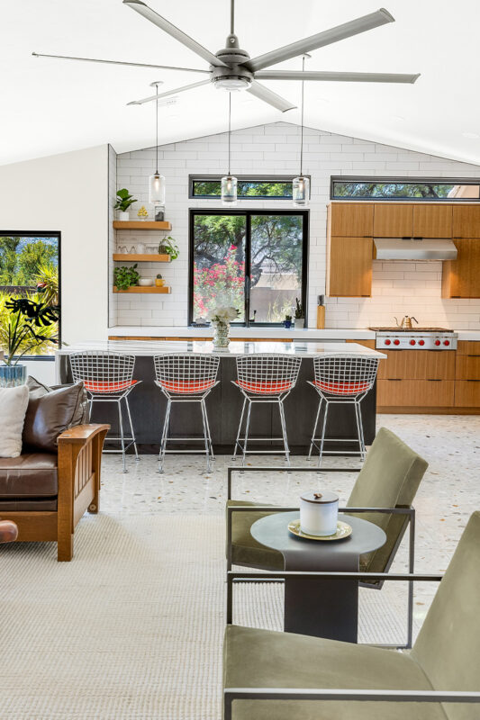 Kitchen with natural cherry perimeter cabinets and dark stained island cabinets.
