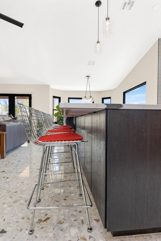 Kitchen with natural cherry perimeter cabinets and dark stained island cabinets.