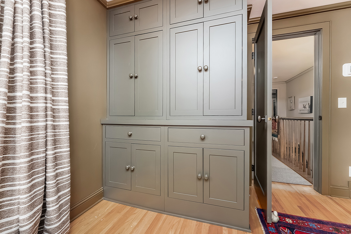 Brown painted bedroom cabinet storage.