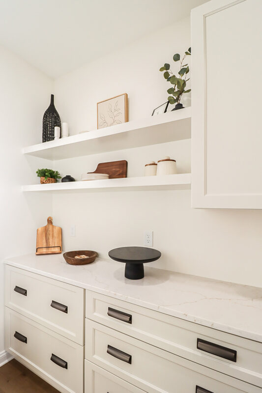 White cabinets with floating shelves