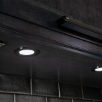 Dark stained bar cabinets with under-cabinet lighting