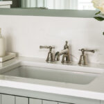 Light green painted bathroom vanity.