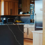 Natural hickory kitchen with black countertop