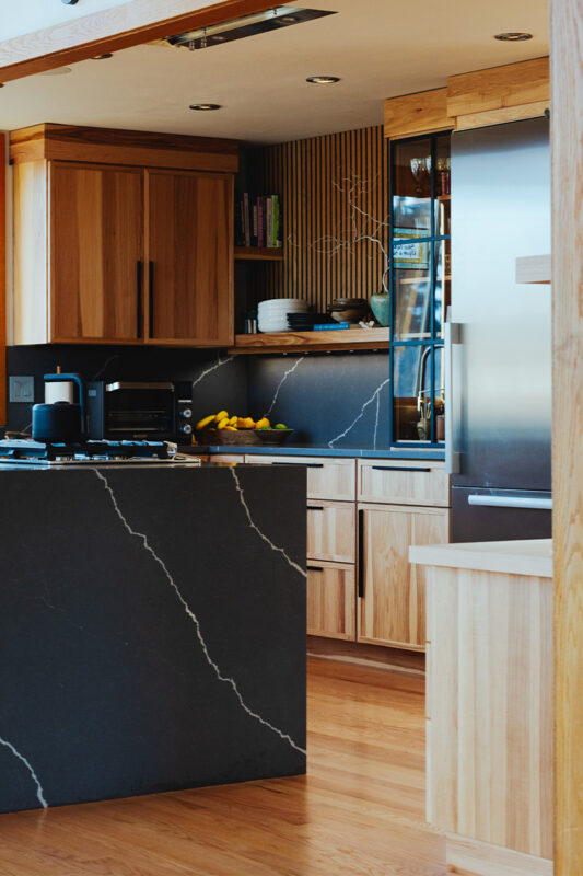 Natural hickory kitchen with black countertop