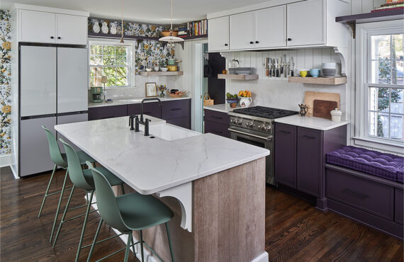 White and purple painted kitchen cabinets with stained hickory island cabinets.