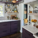 White and purple painted kitchen cabinets.