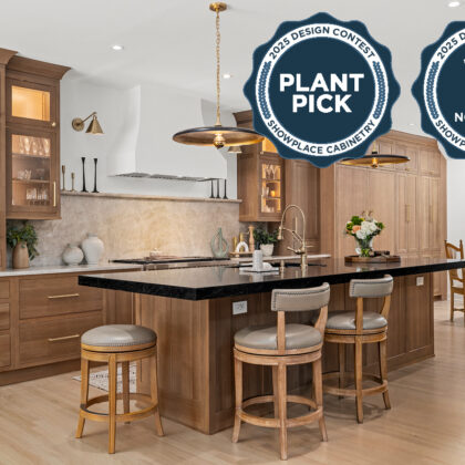 Stained white oak kitchen with a white hood.