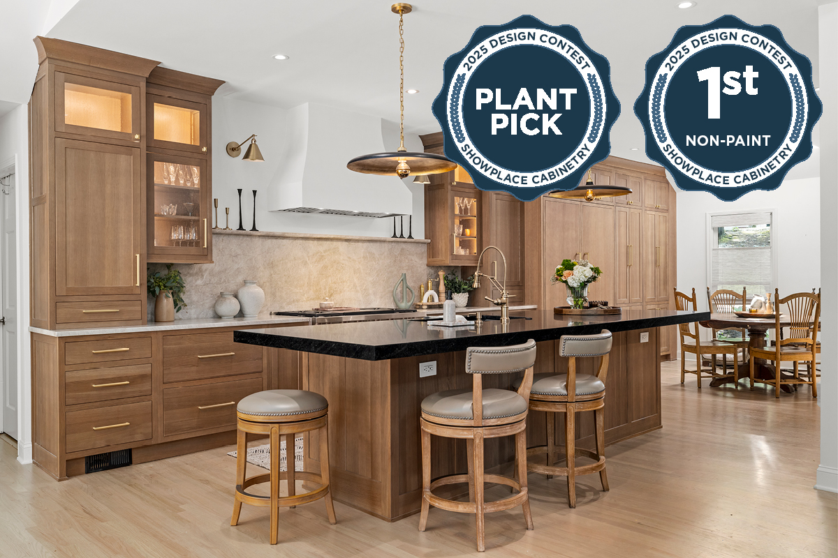 Stained white oak kitchen with a white hood.