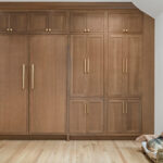 Stained white oak fridge panels covering large refrigerators.