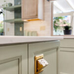 Light green and light brown stained kitchen