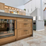 Light brown and painted gray kitchen