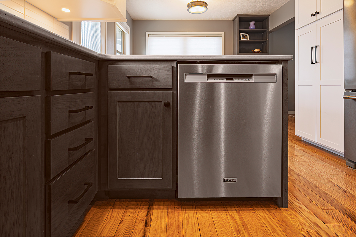 Gray stained cabinets with stainless steel dishwasher